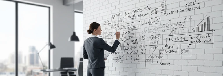  Una persona realizando cálculos en la pared de una empresa. 