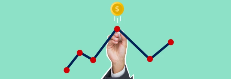  Mano poniendo un punto en un gráfico con un marcador, sobre el cual salta una moneda en un fondo verde 